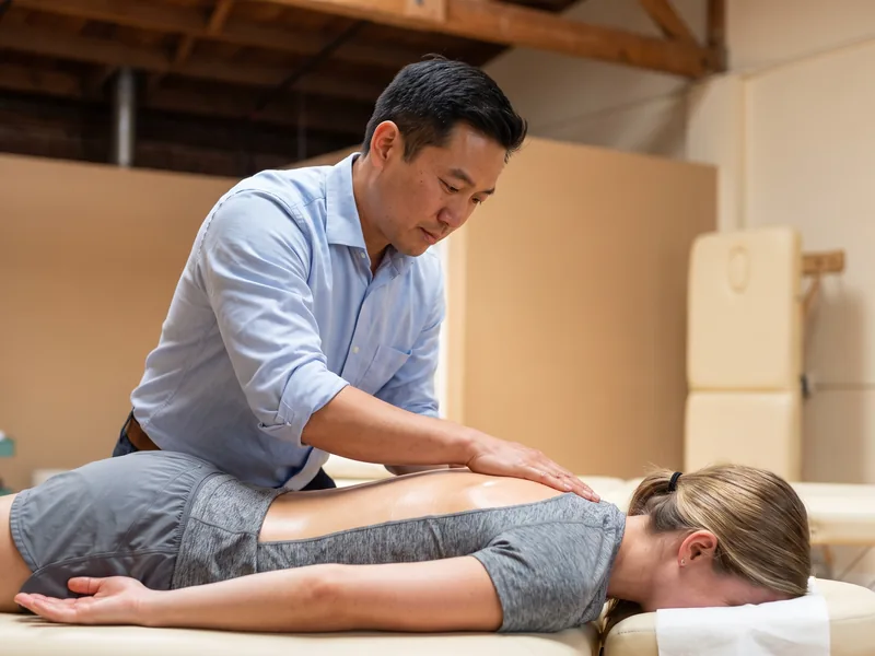 Physical therapist providing hands-on treatment to calm acute pain